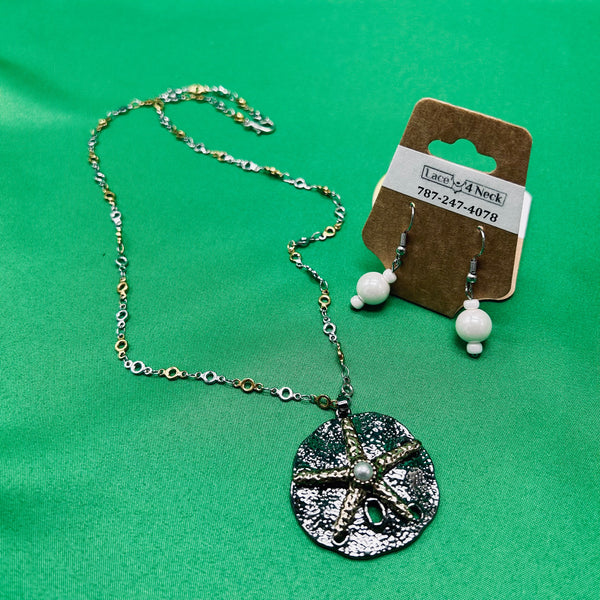 Jewelry set with necklace and earrings on a green background