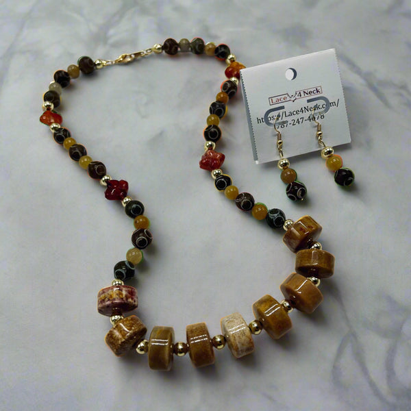 Beaded necklace and earrings with a matching card on a white background