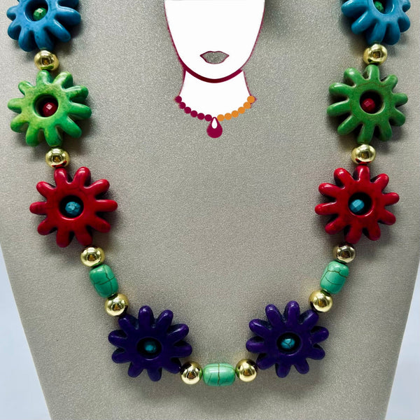 Colorful necklace with floral beads on a display card