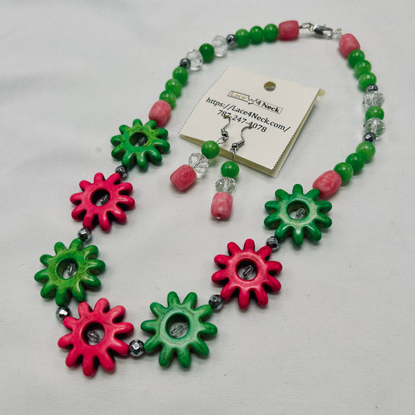 Necklace with pink and green gear-shaped beads on a white background