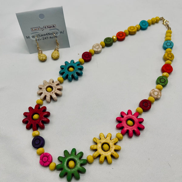 Colorful necklace with flower-shaped beads on a white background