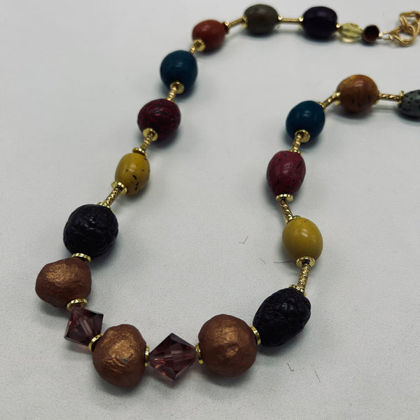 Necklace with multicolored beads on a white background