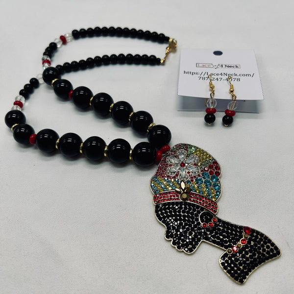 Necklace with colorful pendant and matching earrings on a white background