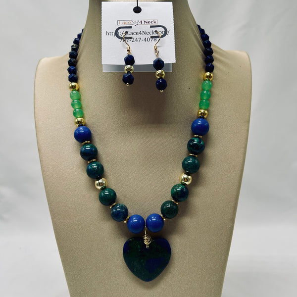 Jewelry set with blue and green beads on a mannequin bust.