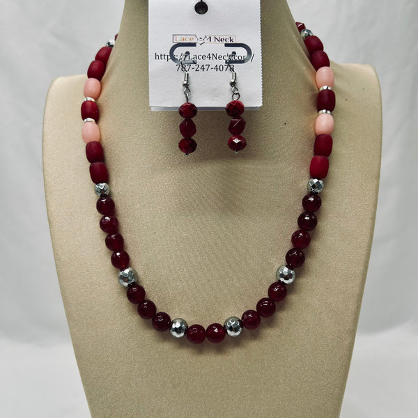 Beaded necklace and earrings set on a mannequin bust with a visible brand tag.