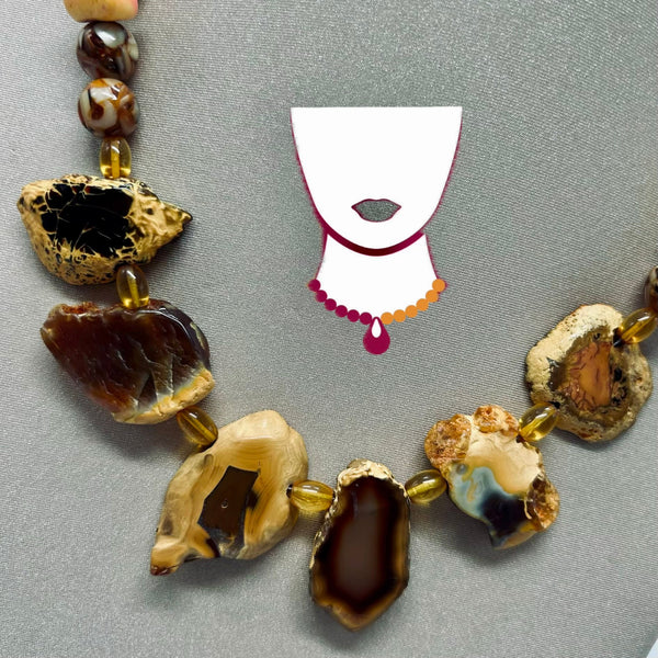 Necklace with natural stone beads on a gray background