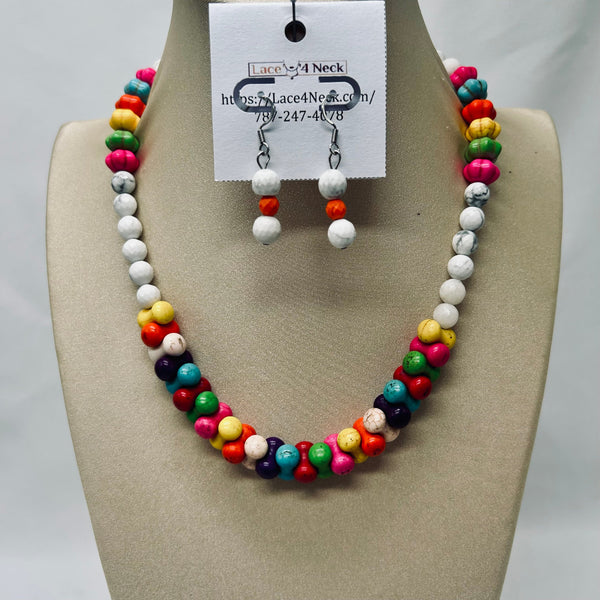 Colorful beaded necklace and earrings on a mannequin bust with a label.
