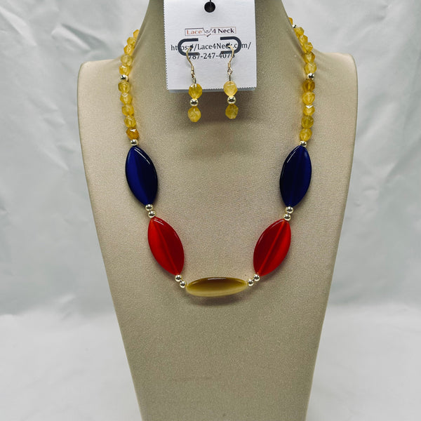 Jewelry set with necklace and earrings on a mannequin bust against a white background