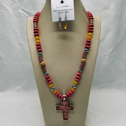 Necklace with cross pendant and beaded design on a beige display stand.
