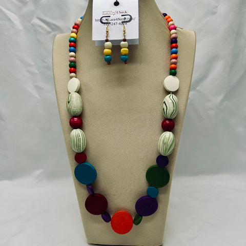 Colorful beaded necklace and earrings on a mannequin bust with a visible brand tag.