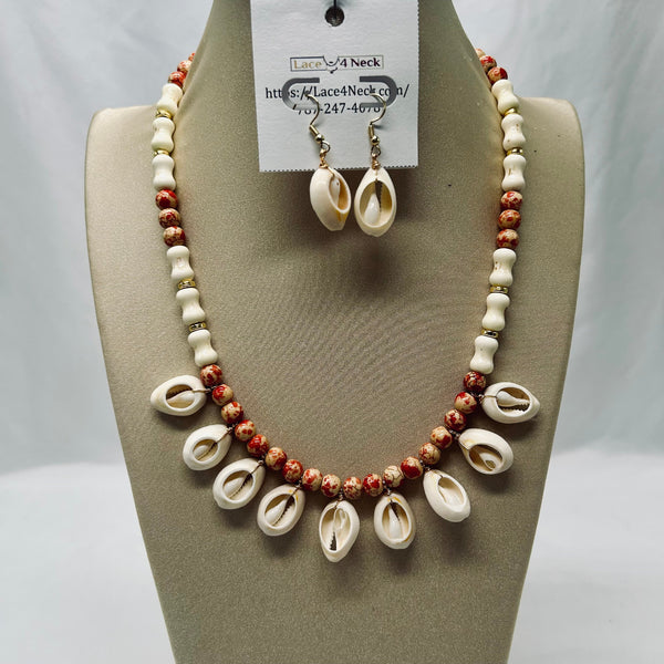 Necklace and earrings set on a mannequin bust with a visible brand tag.