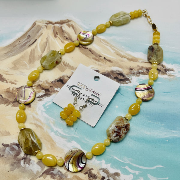 Necklace with yellow and brown beads on a white background