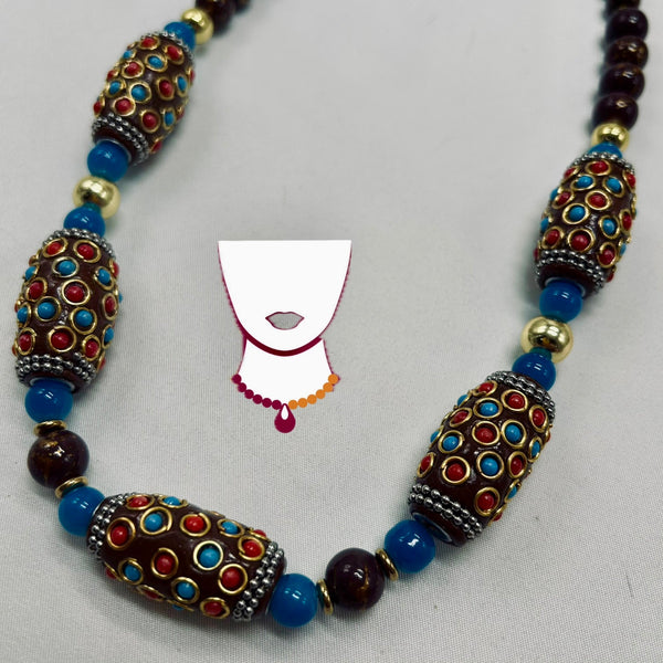 Necklace with decorative beads on a gray background