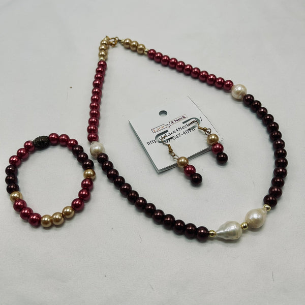 Pearl necklace with maroon, gold, and white beads on a white background