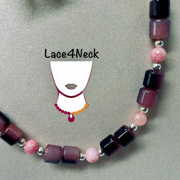 A beaded necklace with alternating dark purple, light pink, and dark red beads separated by small silver spacer beads, displayed on a textured gray background with a Lace4Neck logo overlay.