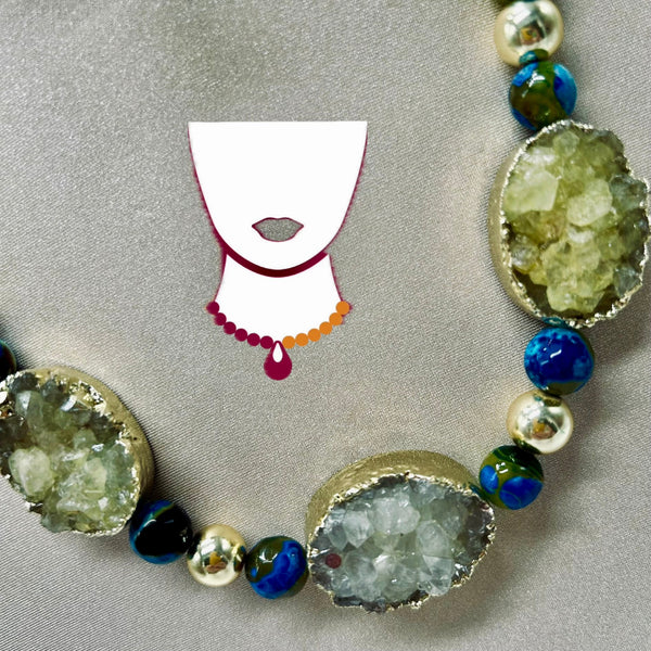 Necklace with natural stone beads on a gray background