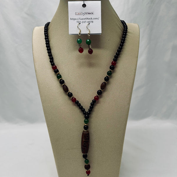 Beaded necklace and earrings on a mannequin bust with a visible brand tag.