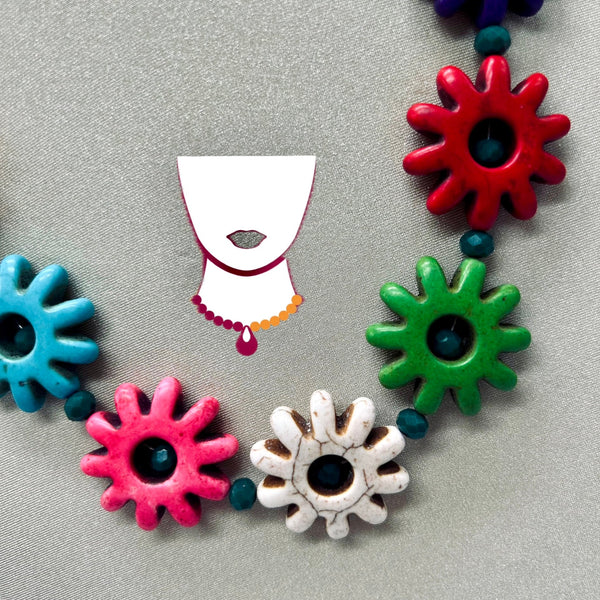 Colorful ceramic beads on a gray background with a minimalist face illustration.