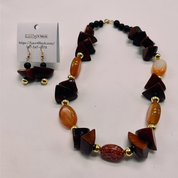 Necklace with brown and gold beads on a white background