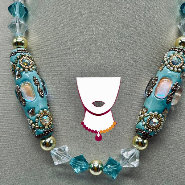 Necklace with decorative beads on a gray background